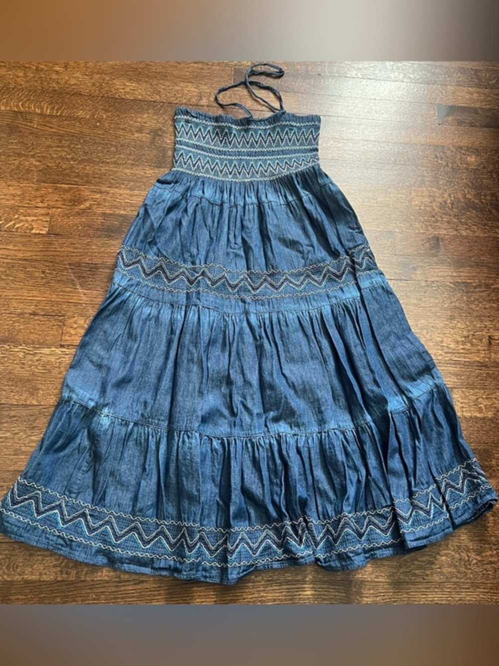 Advance appeals denim tube top dress with embroidered accents. Size Medium